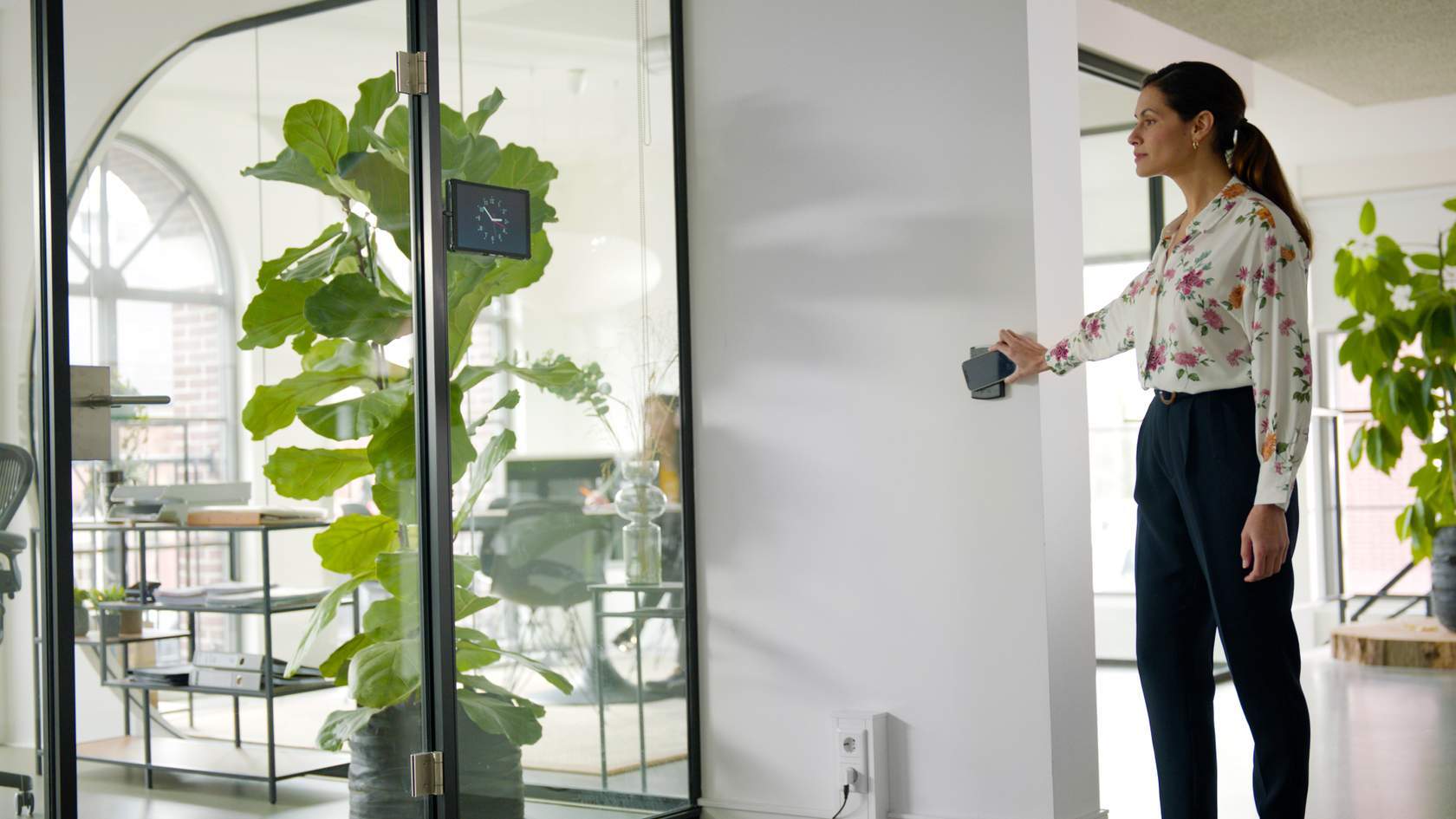 A business owner using mobile credentials to unlock an Access Control door